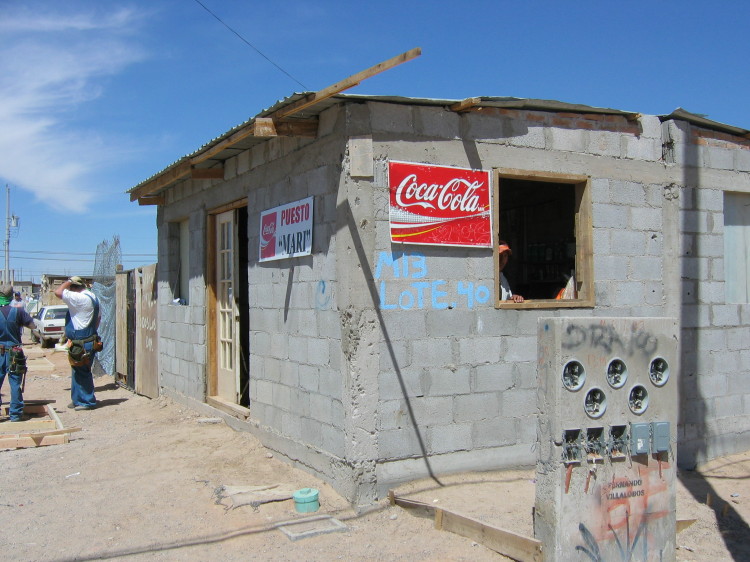 Image 85 of 168
the snack shop on the right again.  This is the cinder block structure at the west end of our house