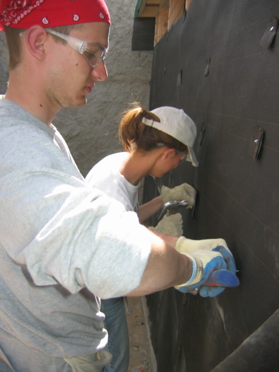Image 99 of 168
tony and jen hang tar paper