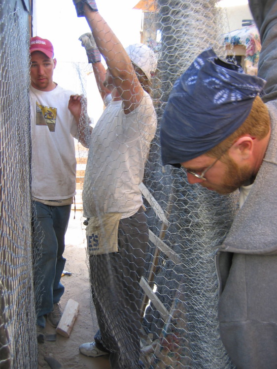 Image 104 of 168
freddie, travis, and joey work on chicken wire
