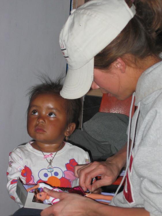 Image 143 of 168
jen unwraps a present for genesis